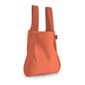 Notabag Terracotta as a shopper bag against a white background