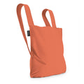 Notabag Terracotta as a backpack against a white background