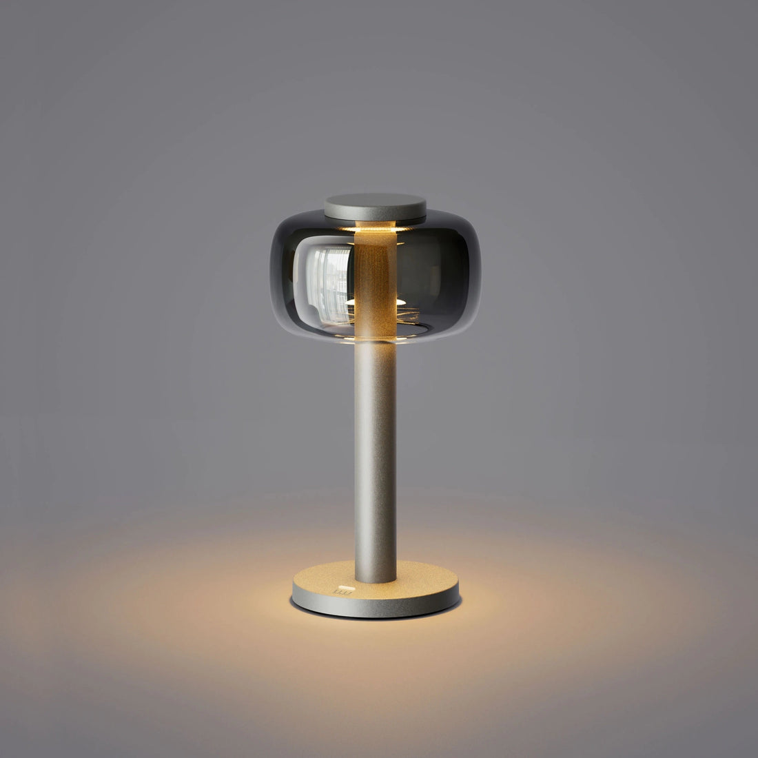 ELLE Decoration Odeon rechargeable table lamp in matt silver, front view on a white background.