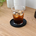 Tower onderzetter Siliconen Zwart│Yamazaki│art. 025393│o p houten blad met glas met cola