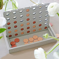 Bordspel Vier op en Rij│Printworks│art. PW00543│uit doos naast vaas met bloemen