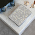 Grey Precious Things jewellery box by Printworks on a coffee table next to other accessories
