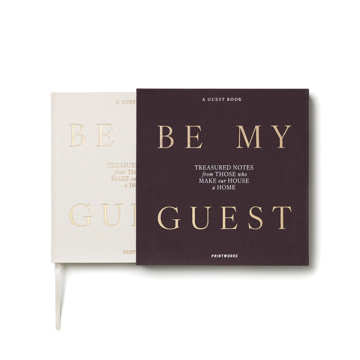 White Be My Guest guest book by Printworks lying flat, half out of its charcoal sleeve