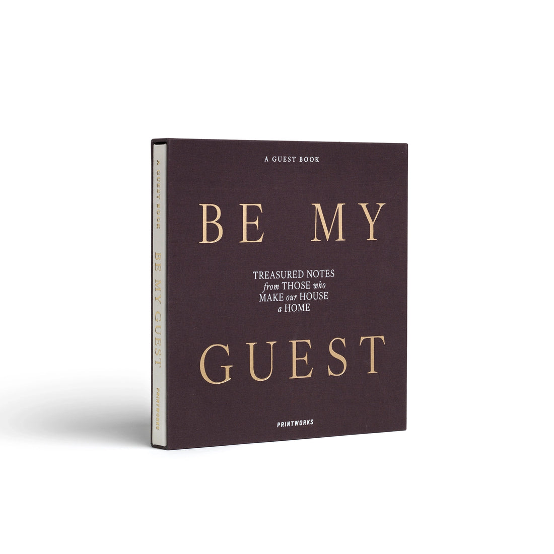 White Be My Guest guest book by Printworks lying flat, half out of its charcoal sleeve
