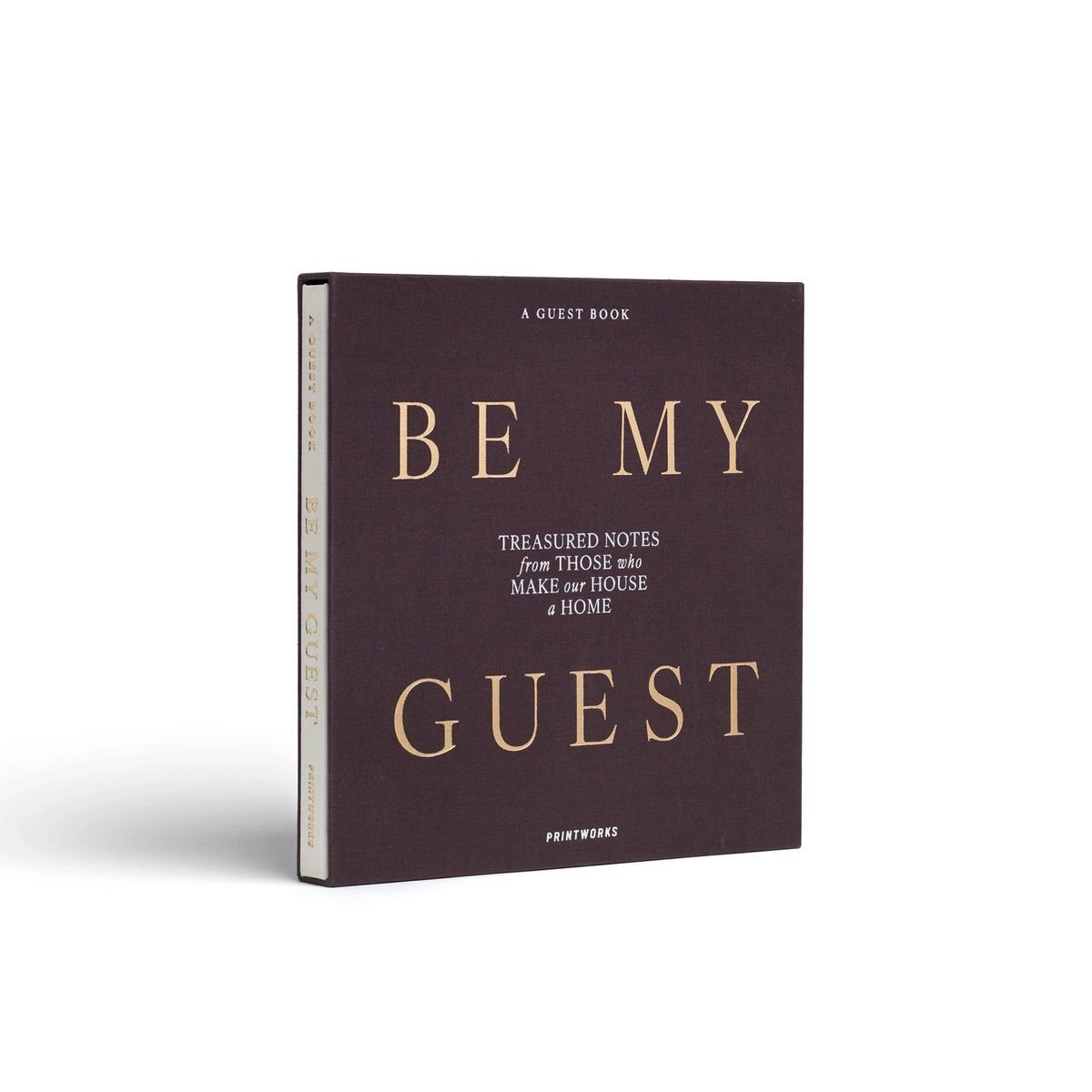 White Be My Guest guest book by Printworks standing upright, seen at an angle from the front