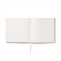 Be My Guest guest book lying open, showing the blank pages