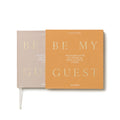 Beige Be My Guest guest book by Printworks lying flat, half out of its yellow sleeve