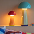 Remember Bobbi Rechargeable LED Table Lamp | Coral | art. LB33 | with Bob Mint on a shelf beside the bed, light on