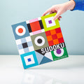 Remember Sudoku Wooden Board Game | the board held in the hand