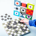 Remember Sudoku Wooden Board Game | a hand placing a tile on the board