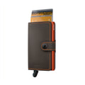 Secrid Miniwallet Matte│art. MM-TRUFFLE&ORANGE│Pasjeshouder│voorkant met uitgeschoven pasjes en clip