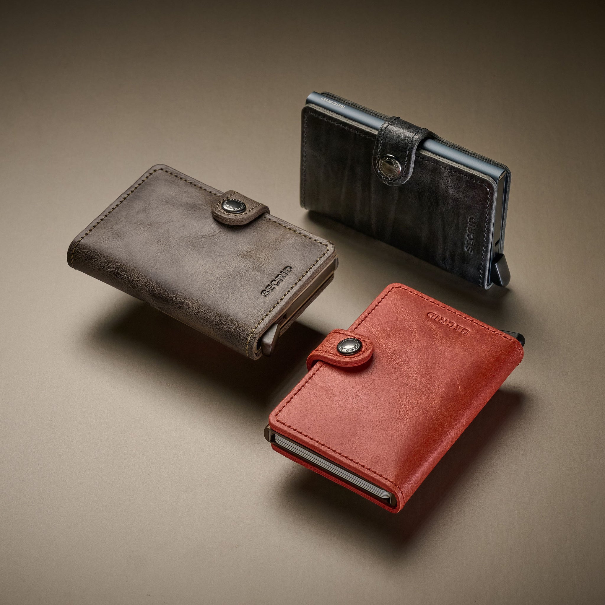 Secrid Miniwallet Vintage│art. MV-ORANGE│Pasjeshouder en Portemonnee│3 verschillende kleuren zwevend met schaduw