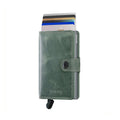 Secrid Miniwallet Vintage│art. MV-SAGE│Portemonnee en pasjeshouder│vooraanzicht met uitgeschoven kaarten en trekmechanisme