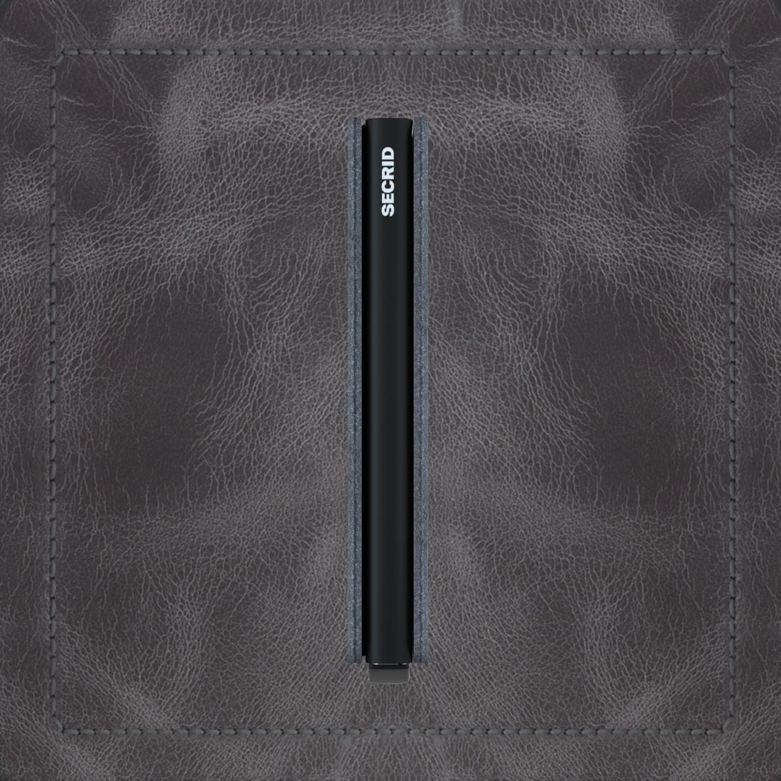 Secrid Slimwallet Vintage│art. SV-GREY-BLACK│Pasjeshouder│zijkant met leersoort op achtergrond