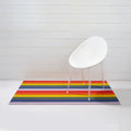Chilewich Shag Deurmat 46x71 Pride Rainbow│art. 200872-001│op witte vloer met wit stoeltje