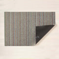 Chilewich Shag Deurmat 61x91 Skinny Stripe Soft Multi│art. 200133-011│bovenaanzicht met omgevouwen hoek op houten vloer
