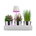 Sompex Peeky Oplaadbare Tafellamp & Groeilamp Wit│art. 72720│in potgrond tussen kuiden met groeilicht aan