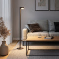Sompex Ronda Oplaadbare Vloerlamp Wit│art. 79071│zwarte versie naast bank met licht aan