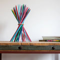 Remember Stickado Houten Mikado Spel | art. MI1 | rechtop op een oude werktafel