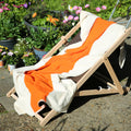 Strandlaken Martens&Martens Royal Orange&Brown│Suite702│art. MMTT90ORBR│op strandstoel in tuin