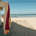 Strandlaken Martens & Martens Suite702│art. CMMTT90YEFUOROL│opgehangen aan strandhuisje