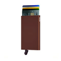 Secrid Cardprotector│art. C-BROWN│Pasjeshouder│voorkant met uitgeschoven pasjes en clip