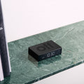 Lexon Flip Premium Wekker Zwart│Art. LR152N│op marmeren plank naast boeken