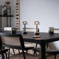 Humble Two Oplaadbare Tafellamp Gold Smoked│Draadloos│art. HUMTL00205│tweemaal op eettafel met licht aan