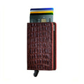 Secrid Slimwallet Nile│art. SN-BROWN│Pasjeshouder│voorkant met uitgeschoven pasjes en clip