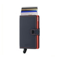 Secrid Miniwallet Matte│Pasjeshouder en Portemonnee│art. MM-NIGHTBLUE&ORANGE│vooraanzicht met uitgeschoven pasjes en clip