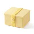 Uhmm 02 Opvouwbare Luchbox Citrus│art. 981277│vooraanzicht met strap in Citrus